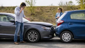 Driver reviewing insurance options after another vehicle caused a minor accident.